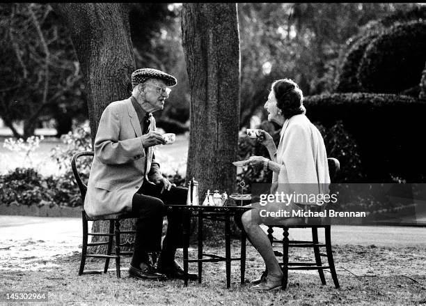 English writer Sir Pelham Grenville Wodehouse, KBE, aka P. G. Wodehouse, takes tea with his wife Ethel in Remsenburg, New York State, 14th December...