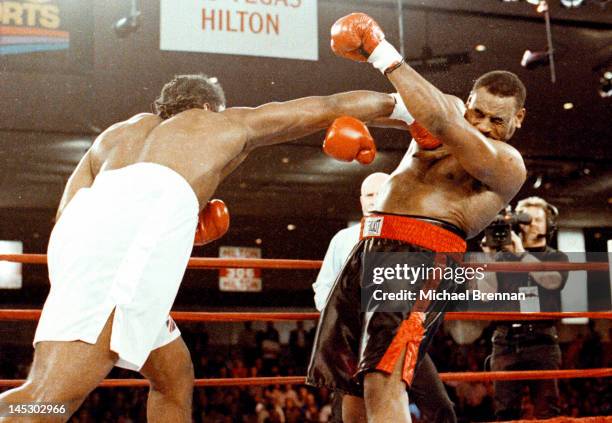 American Heavyweight boxer Oliver McCall receives a blow to the jaw from Lennox Lewis connects to McCall's jaw in the second round at the Hilton...