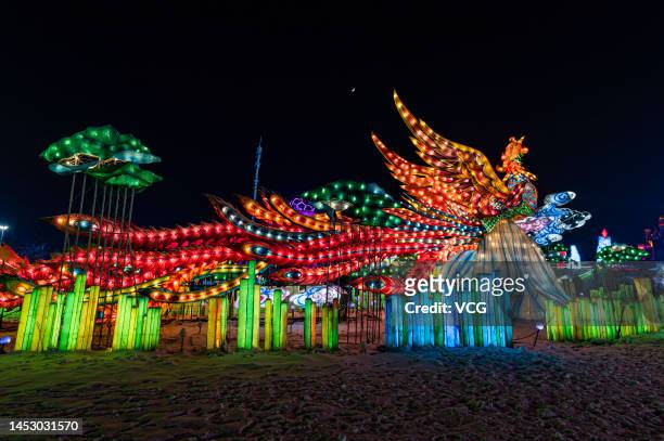 Ice sculptures are illuminated as the 26th Changchun Ice and Snow Festival kicks off at Changchun Ice and Snow New World on December 28, 2022 in...