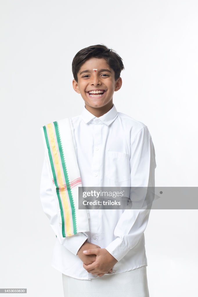 Happy south indian boy in traditional clothing
