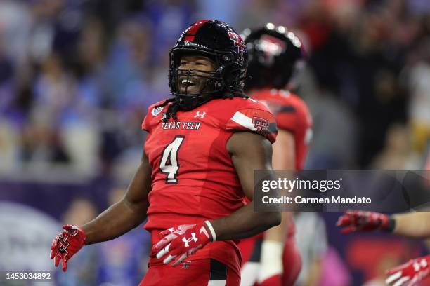 SaRodorick Thompson of the Texas Tech Red Raiders celebrates his touchdown against the Mississippi Rebels during the second half at NRG Stadium on...