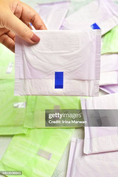 woman picking up sanitary pad, menstrual pads - adults wearing cloth diapers ストックフォトと画像