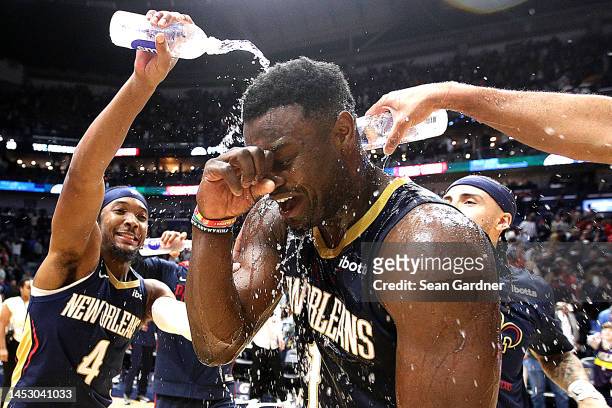 Zion Williamson of the New Orleans Pelicans is sprayed with water by teammates after scoring 43 points after an NBA game against the Minnesota...