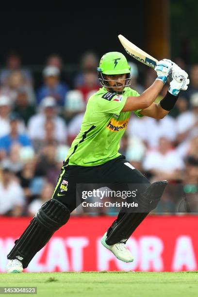 Oliver Davies of the Thunder bats during the Men's Big Bash League match between the Brisbane Heat and the Sydney Thunder at Metricon Stadium, on...