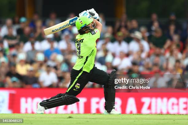 Oliver Davies of the Thunder bats during the Men's Big Bash League match between the Brisbane Heat and the Sydney Thunder at Metricon Stadium, on...