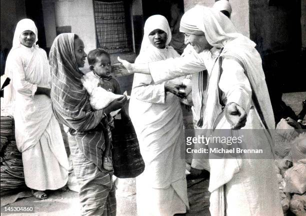 Mother Teresa of Calcutta , Head of the Sisters of Charity, working with some of the lepers in Calcutta, 7th December 1971. These are some of the...