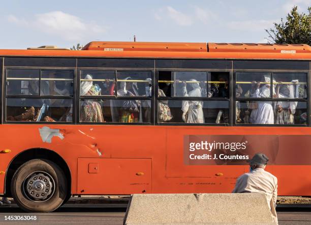 Packed city bus makes a stop on Sematat Avenue during rush hour on December 28, 2022 in Asmara, Eritrea. Asmara was originally constructed as the...