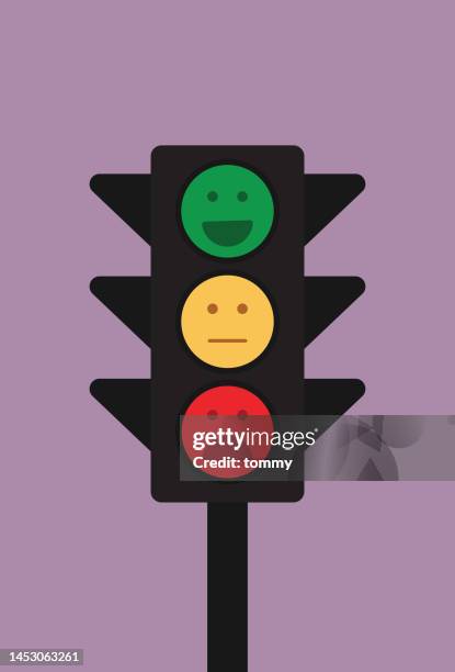 traffic lights show an emoticon for mental health concept, facial expression in a traffic lights - technophobe stock illustrations