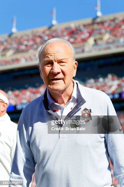 Former head coach Barry Switzer of the Oklahoma Sooners walks through the end zone during a game against the Baylor Bears at Gaylord Family Oklahoma...