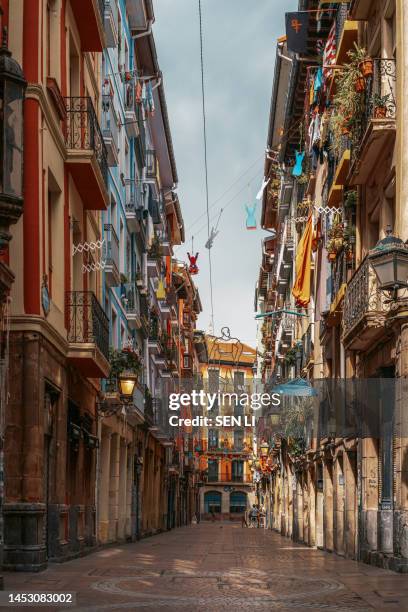 historic street with colorful buildings in bilbao old city, spain - bilbao spain photos et images de collection