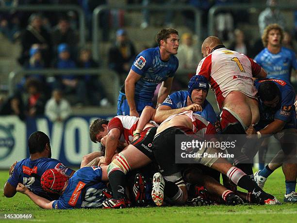 Van Der Linde of the Lions gets his shorts pulled down during the round 14 Super Rugby match between the Western Force and the Lions at NIB Stadium...