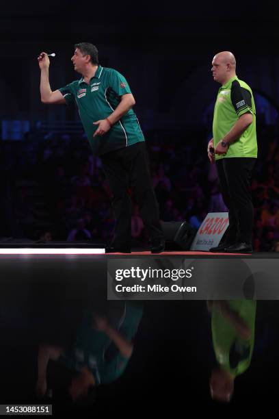 Mensur Suljovic of Serbia competes during his Third Round match against Michael van Gerwen of Netherlands during Day Nine of The Cazoo World Darts...