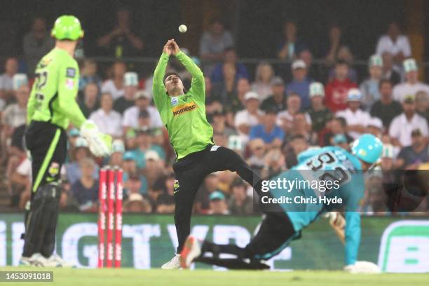 Oliver Davies of the Thunder drops a catch during the Men's Big Bash League match between the Brisbane Heat and the Sydney Thunder at Metricon...