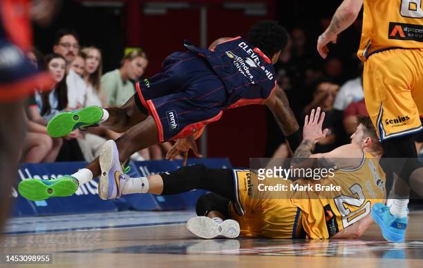 Nathan Sobey of the Brisbane Bullets takes out Antonius Cleveland of the 36ers and is fouled out of the game during the round 13 NBL match between...