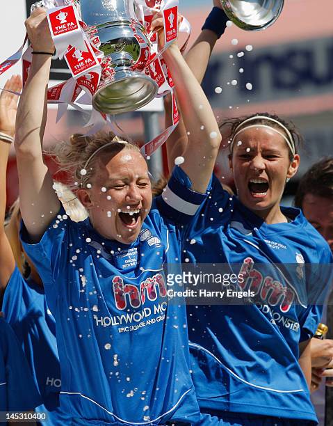 Birmingham captain Laura Bassett holds the trophy aloft as Emily Westwood celebrates during the FA Women's Cup Final between Birmingham City Ladies...