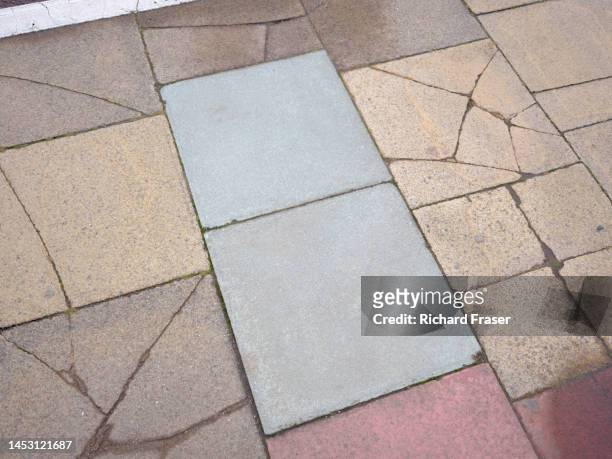 pavement made from a myriad of tiles, brighton, uk. - block paving stockfoto's en -beelden