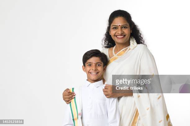 portrait of south indian woman her son in traditional clothing - indian mother and child stock pictures, royalty-free photos & images