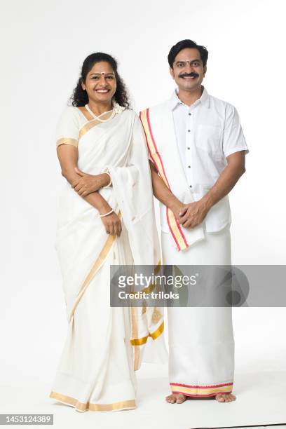 south indian couple posing in traditional clothing - south indian ethnicity stock pictures, royalty-free photos & images