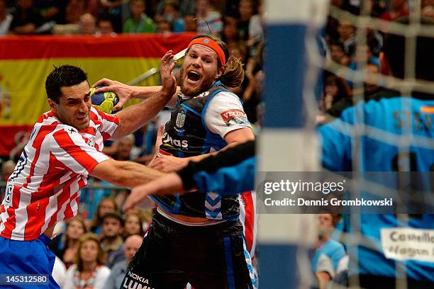 Mikkel Hansen of Kobenhavn is challenged by Kiril Lazarov of Madrid during the EHF Final Four semi final match between BM Athletico Madrid and AG...