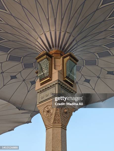 a view of the automatic umbrellas in prophet mosque in madinah, also known as masjid an nabwi | arches architecture design | rawdah rasool, riyadh ul jannah | prophet muhammad | saudi arabia - hajj stock pictures, royalty-free photos & images