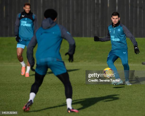 Bruno Guimaraes passes the ball during the Newcastle United Training Session at the Newcastle United Training Centre on December 29, 2022 in...