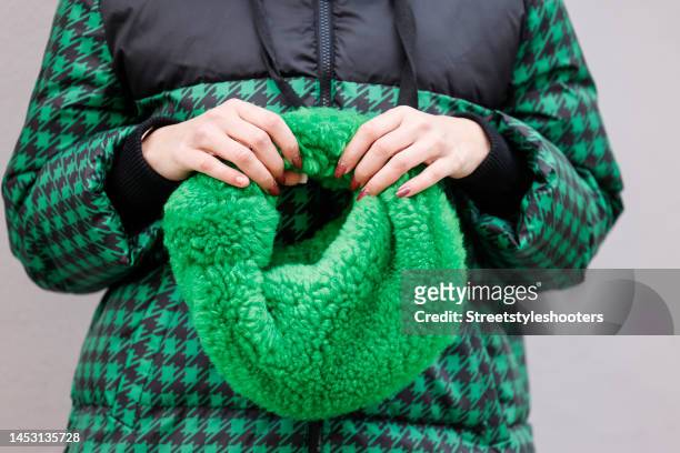 German presenter Verena Kerth, wearing a green and black checked jacket with hood by Stella Sabatoni and a green teddy fur bag by Botega Veneta,...