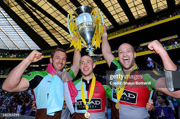 Chris Robshaw, Mike Brown and George Robson celebrate with the trophy following their team's victory during the Aviva Premiership final between...