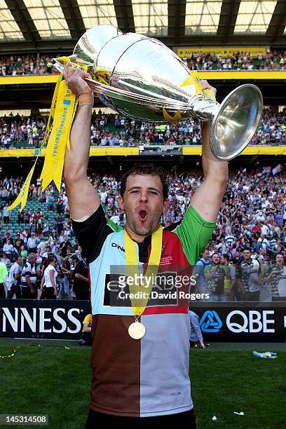 Fly Nick Evans of Harlequins celebrates with the trophy following his team's victory during the Aviva Premiership final between Harlequins and...