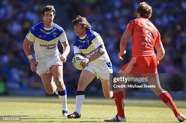 Lee Briers of Warrington Wolves looks to offload during the Stobart Super League 'Magic Weekend' match between Warrington Wolves and Widnes Vikings...