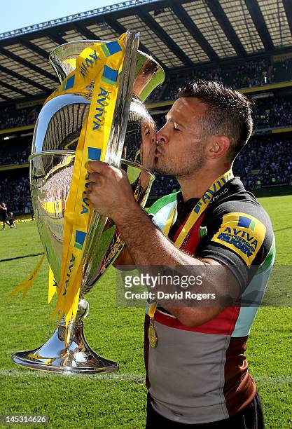 Harlequins scrumhalf Danny Care ckisses the trophy following his team's victory during the Aviva Premiership final between Harlequins and Leicester...