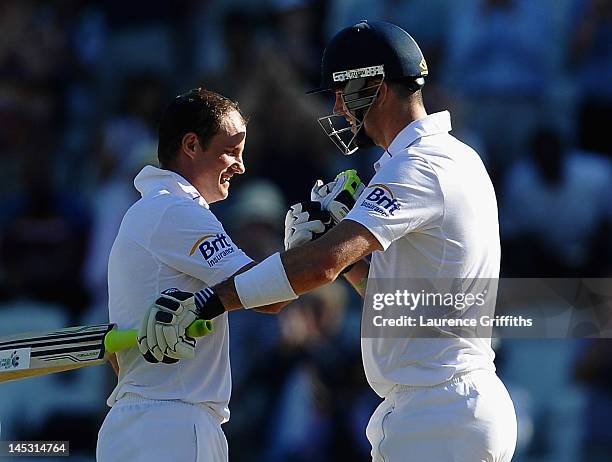 Andrew Strauss of England celebrates his century with Kevin Pietersen during the Second Investec Test match between England and West Indies at Trent...