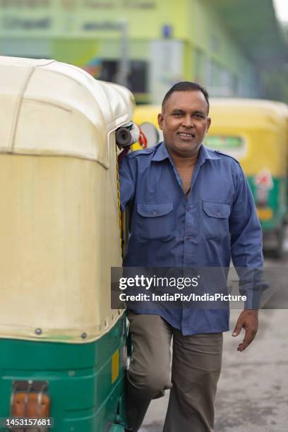 Auto Rickshaw Man Photos and Premium High Res Pictures - Getty Images