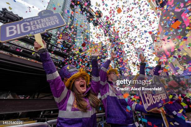 People cheer as confetti is thrown from the Planet Fitness stage during the ‘confetti test’ ahead of New Year’s Eve in Times Square on December 29,...