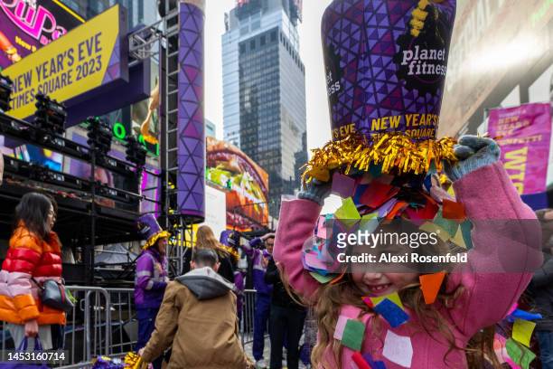 Juliette Medeiros, six-years-old, from New Hampshire, dumps confetti on herself with confetti during the ‘confetti test’ ahead of New Year’s Eve in...