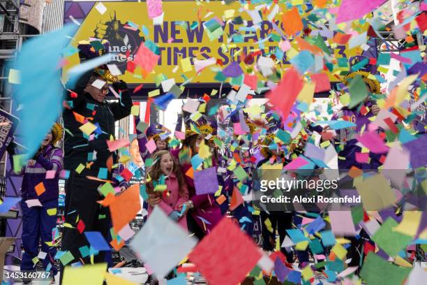 Jamie Medeiros, and Juliette Medeiros, six years-old, from New Hampshire, react to confetti falling during the ‘confetti test’ ahead of New Year’s...