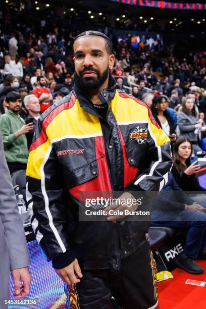 Rapper Drake leaves the court following the NBA game between the Toronto Raptors and the LA Clippers at Scotiabank Arena on December 27, 2022 in...