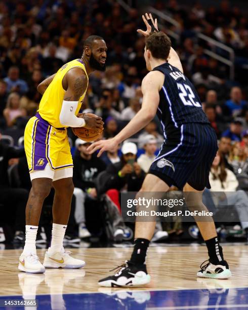 LeBron James of the Los Angeles Lakers handles the ball against the Orlando Magic during the third quarter at Amway Center on December 27, 2022 in...