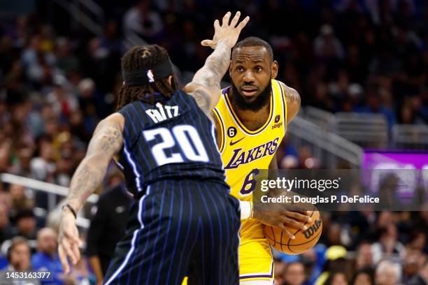 LeBron James of the Los Angeles Lakers handles the ball as Markelle Fultz of the Orlando Magic defends during the fourth quarter at Amway Center on...