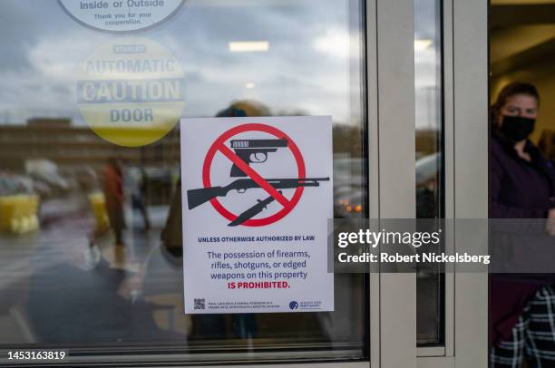 Sign prohibiting weapons inside meets people December 23, 2022 entering Albany Medical Center in Albany, New York.