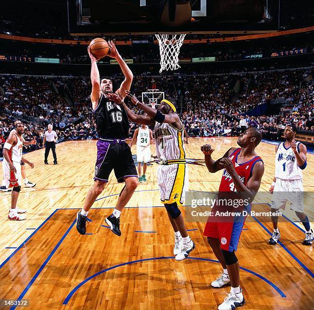 Peja Stojakovic of the Sacramento Kings shoots over Jermaine O''Neal of the Indiana Pacers during the 2002 NBA All Star Game at the First Union...