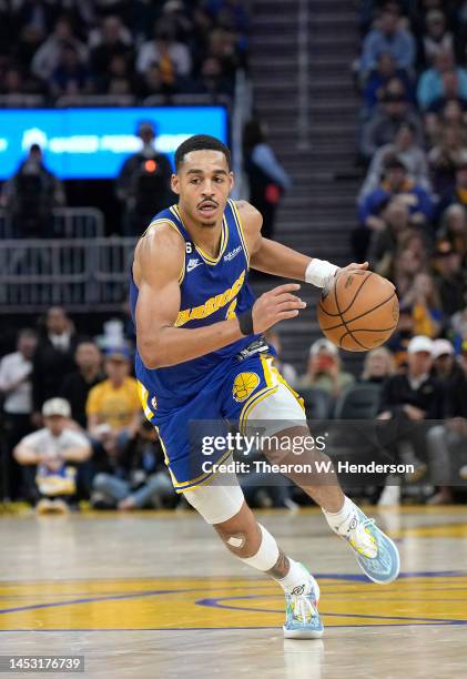 Jordan Poole of the Golden State Warriors dribbles the ball against the Utah Jazz during the second quarter of an NBA basketball game at Chase Center...