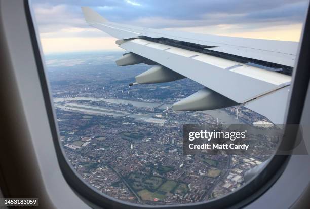 The East End of London is viewed from a aircraft window that is coming into land, on July 08, 2017 in London, England. The skies above London are...