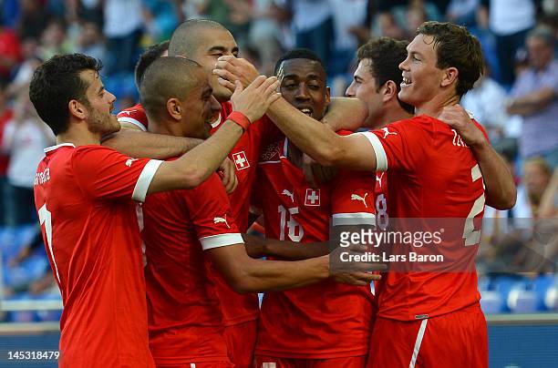 Stephan Lichtsteiner of Switzerland celebrates with team mates after scoring his teams fourth goal during the international friendly match between...