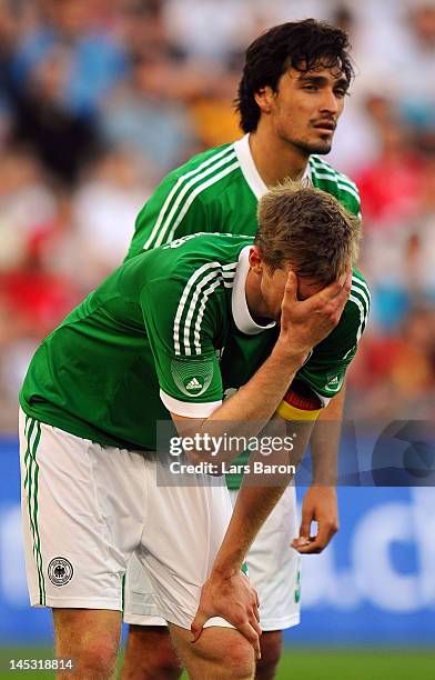 Per Mertesacker and Mats Hummels of Germany are looking dejected during the international friendly match between Switzerland and Germany at St....