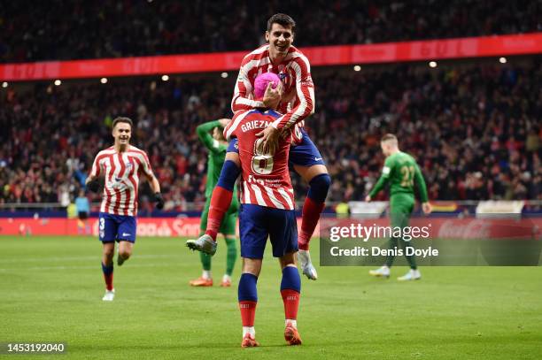 Alvaro Morata of Atletico Madrid celebrates with team mate Antoine Griezmann after scoring their sides second goal during the LaLiga Santander match...