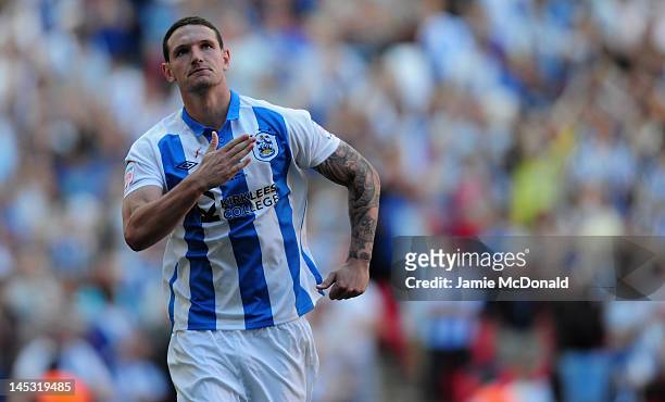 Sean Morrison of Huddersfield Town celebrates scoring a penalty during the penalty shoot out during the npower League One, playoff final between...