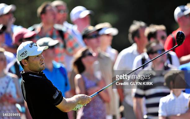 South African golfer Branden Grace watches his drive from the 11th tee during the third round of the PGA Championship at Wentworth Golf Club in...