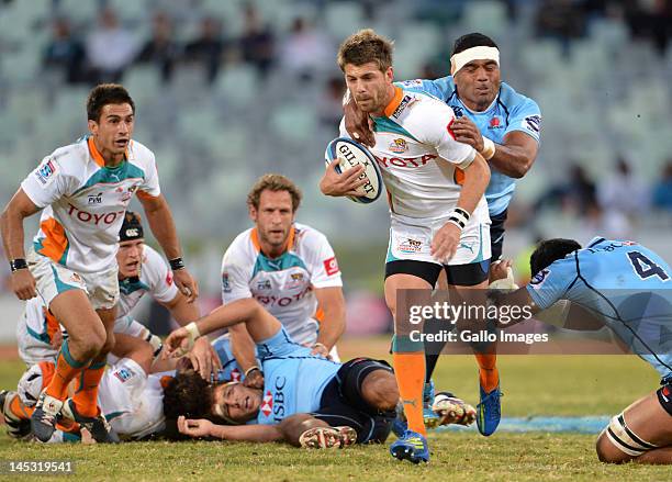 Willie le Roux of the Cheetahs is tackled by Wycliff Palu of the Waratahs during the Super Rugby match between Toyota Cheetahs and Waratahs from Free...