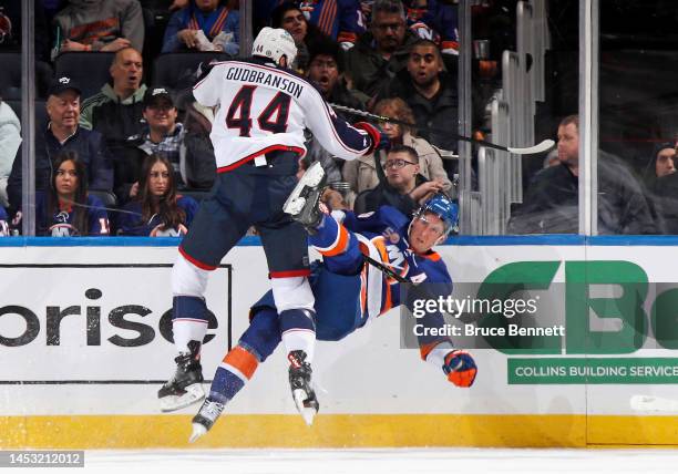 Erik Gudbranson of the Columbus Blue Jackets hits Brock Nelson of the New York Islanders during the first period at UBS Arena on December 29, 2022 in...