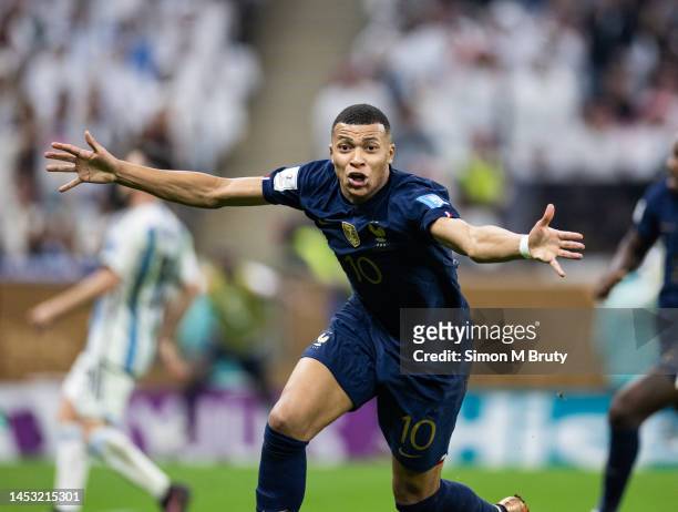 Kylian Mbappe of France celebrates scoring a goal to make it 2-2 during the FIFA World Cup Qatar 2022 Final match between Argentina and France at...